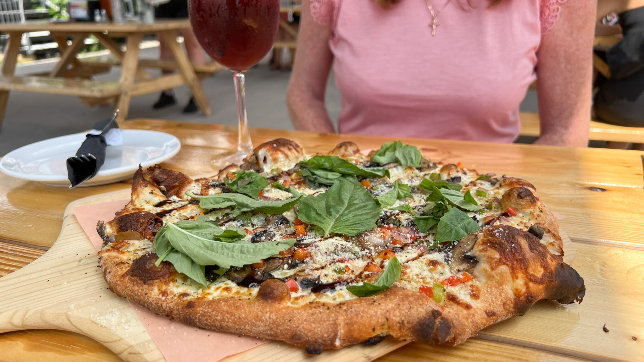 Pillitteri Estates Winery | Krista the Explorer Stone baked pizza on table with summer sangria.