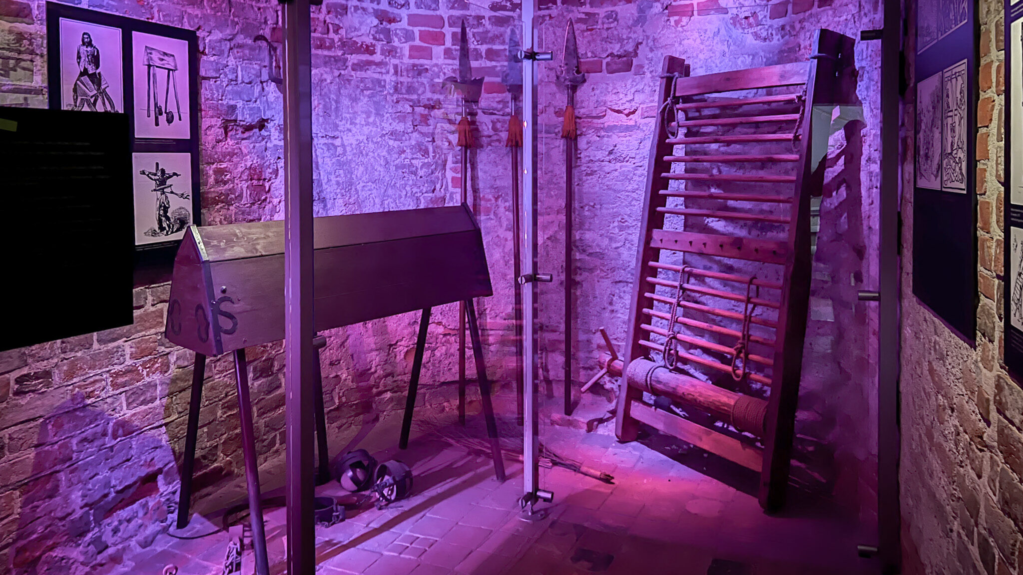 Purple lighting inside torture chamber in tower.