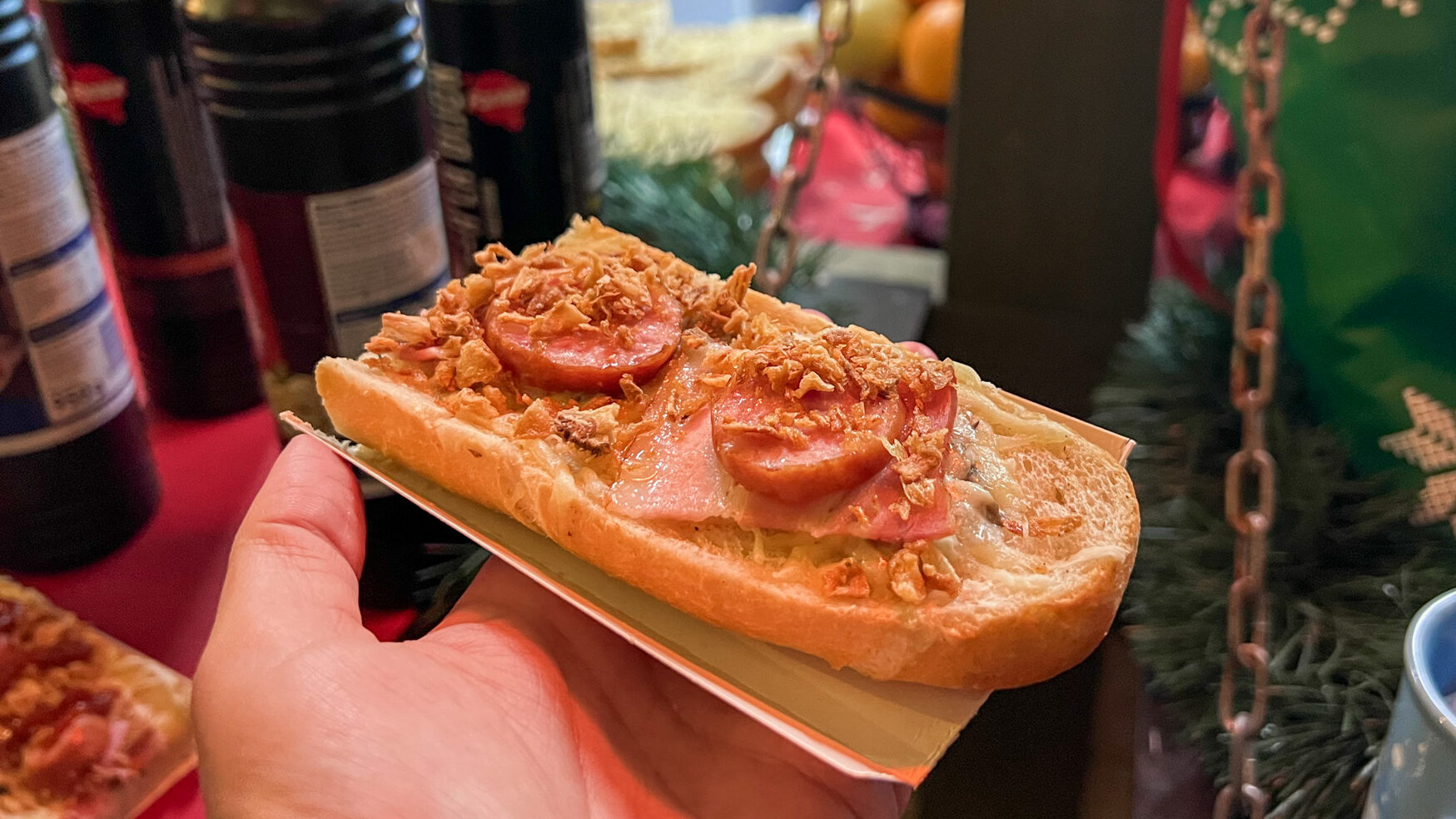 Open-faced sandwich with cheese and meat.