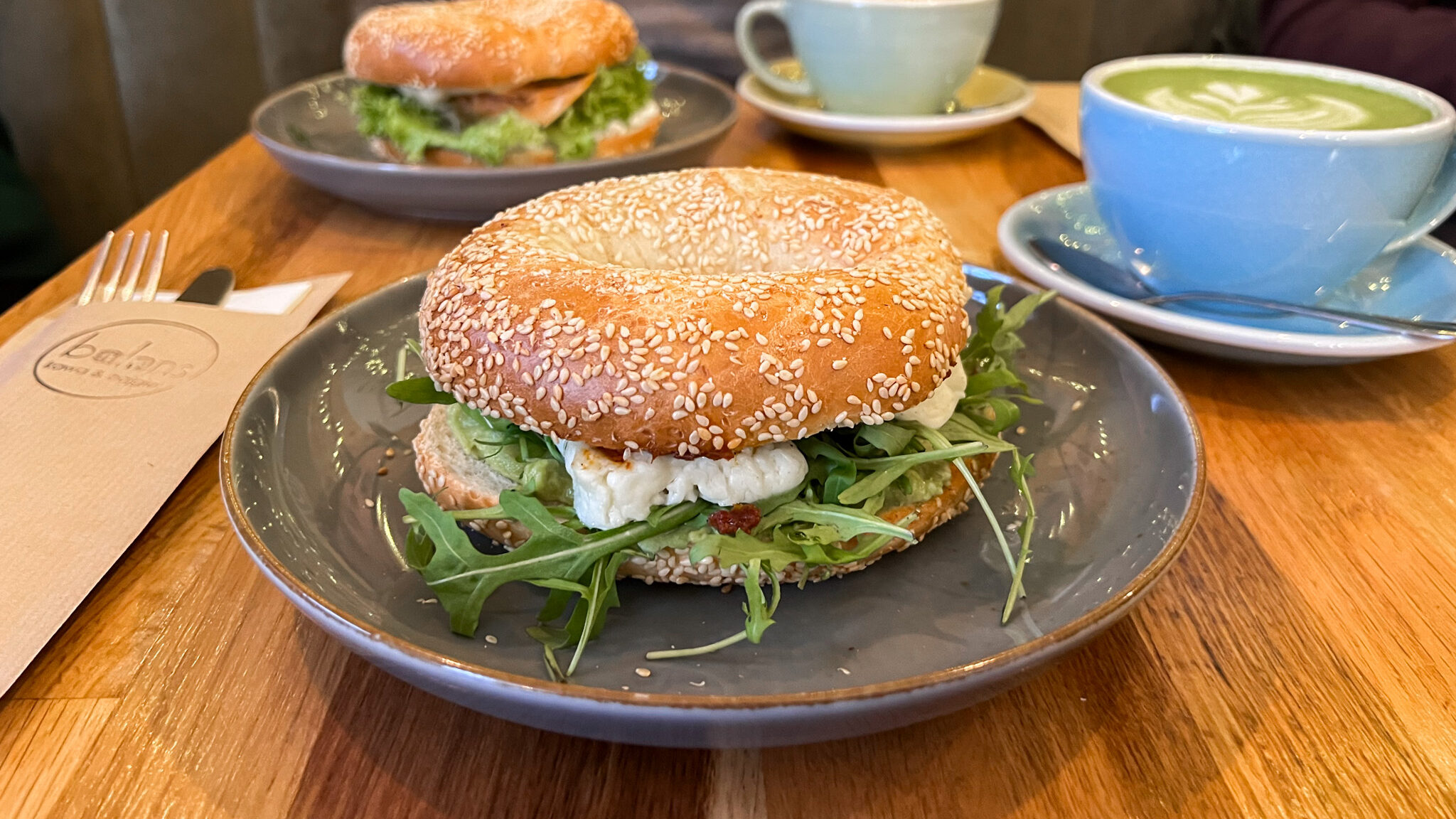 Sesame bagel with halloumi and salad. 