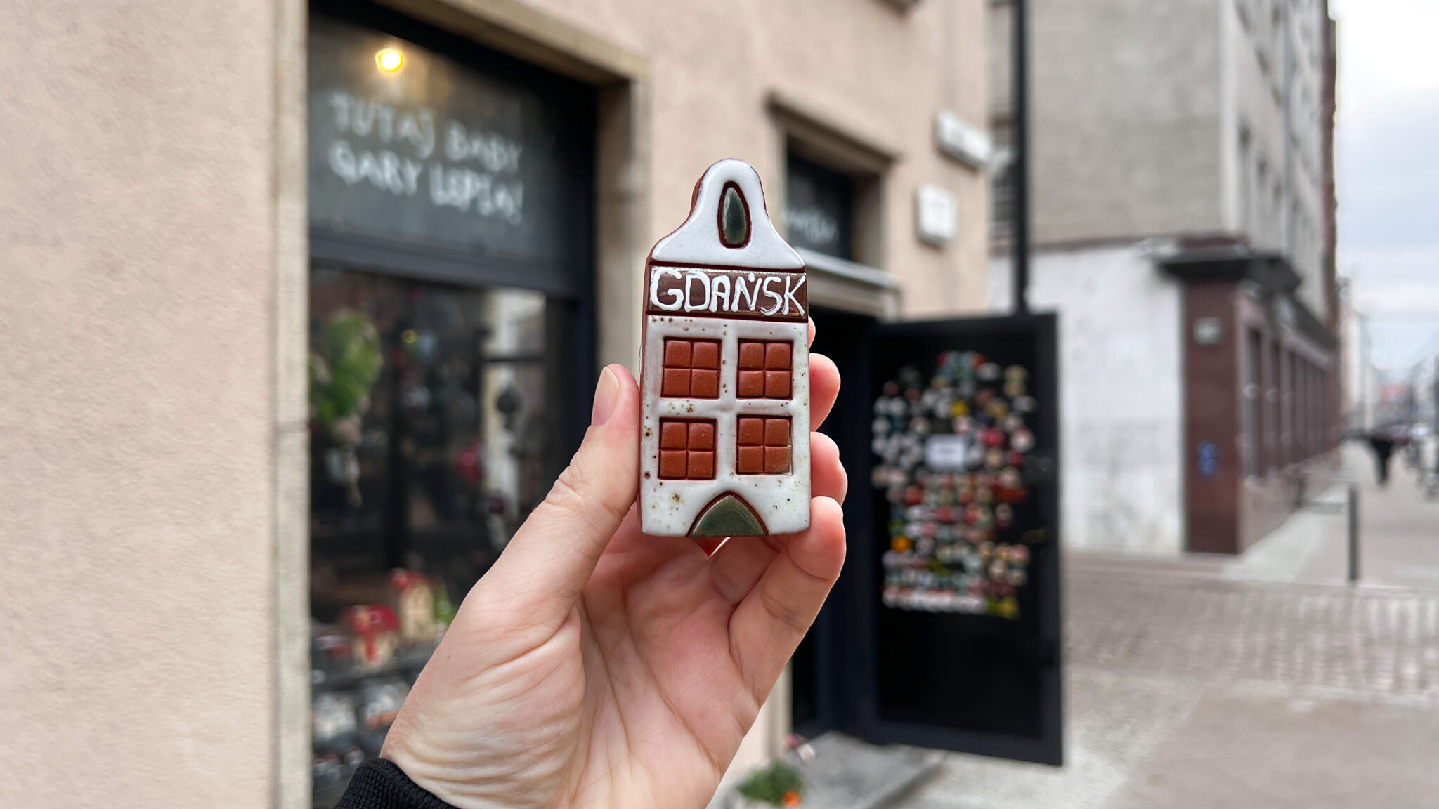 Small handmade house in front of ceramic shop in Gdansk.