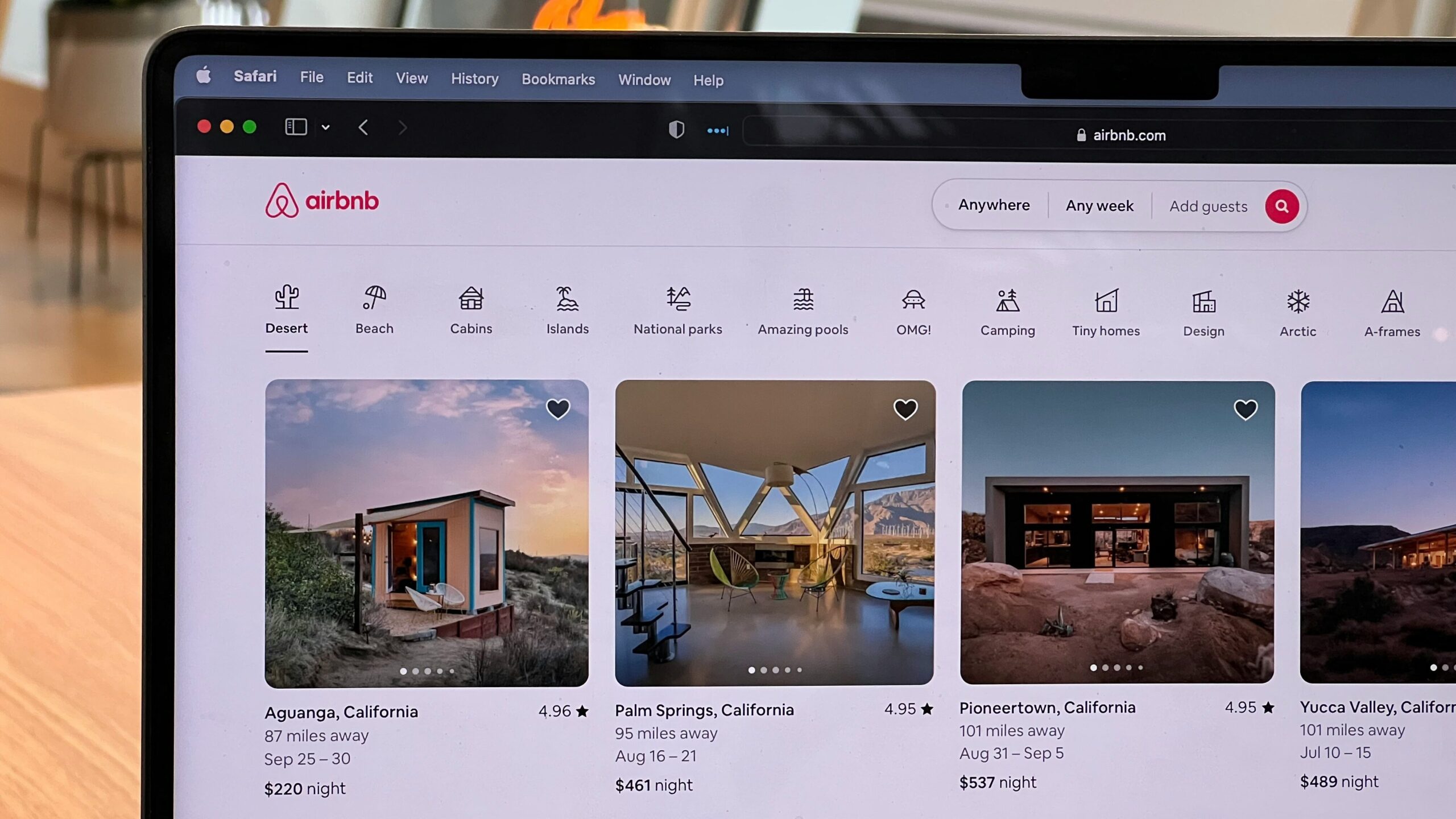 AI Search Engine | Krista the Explorer Laptop open with Airbnb search page.