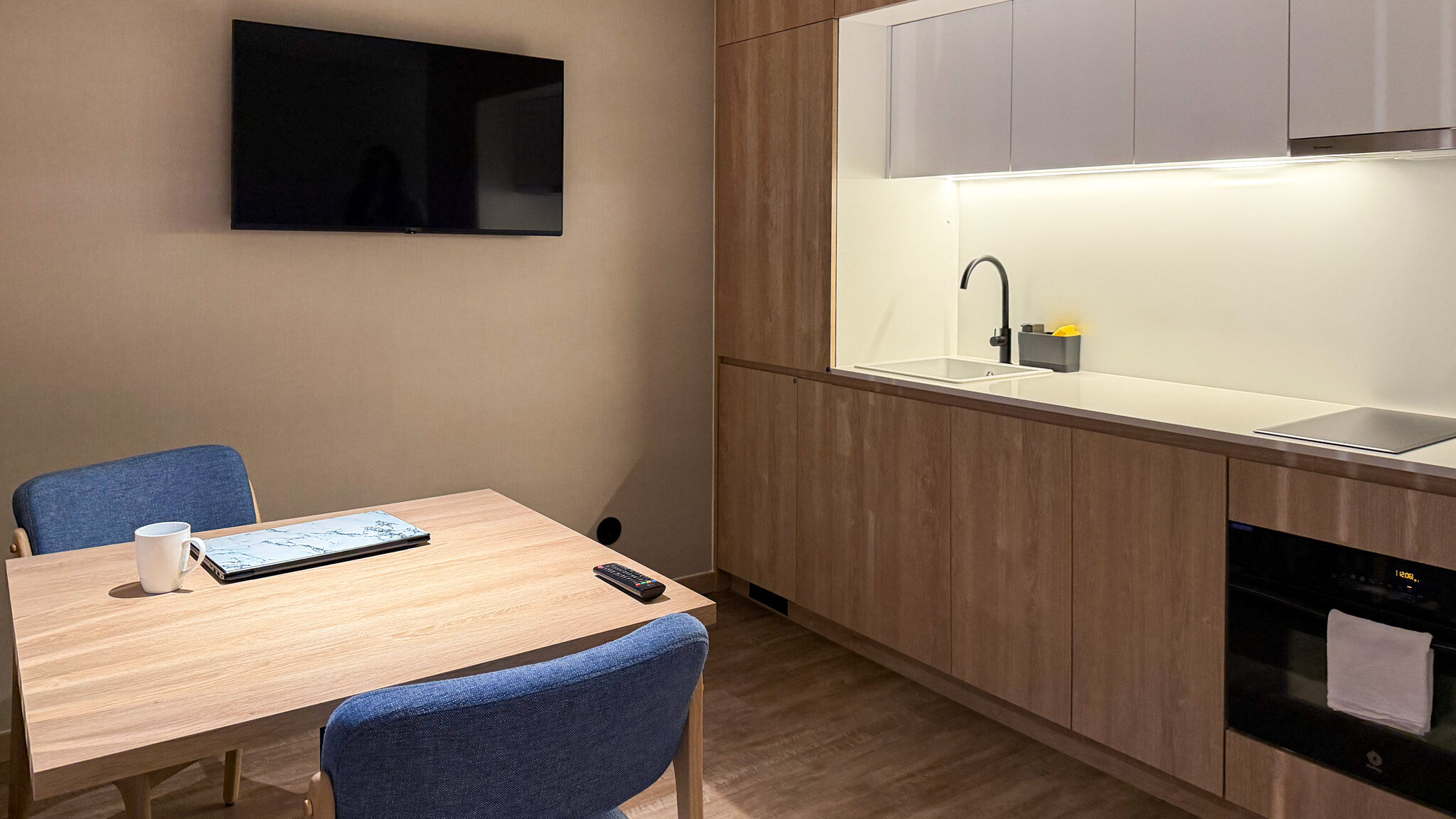 Open plan kitchen and dining room in apartment.