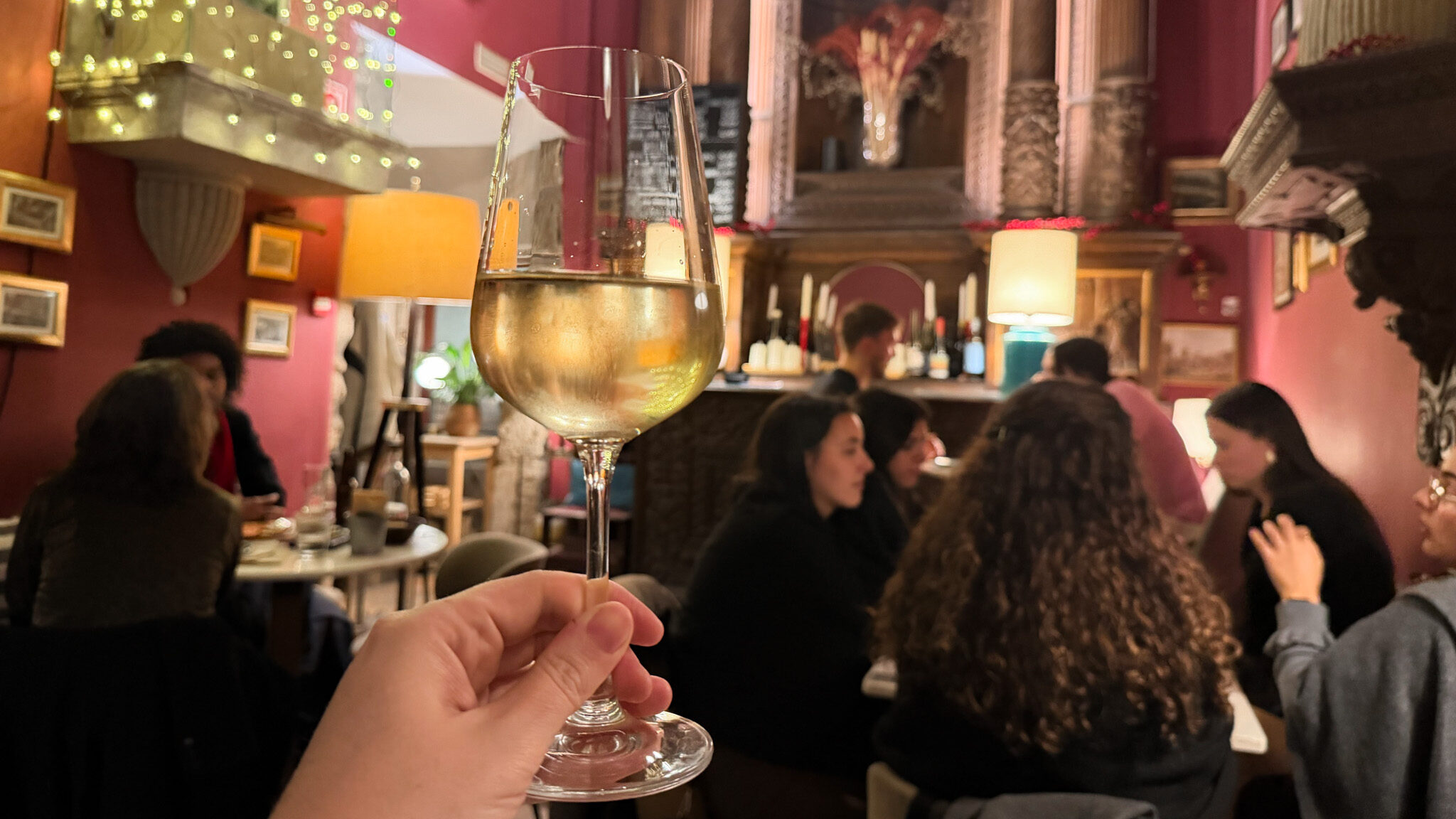 Glass of wine served inside old church in Porot.
