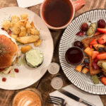 Breakfast burger and French toast with fruit.