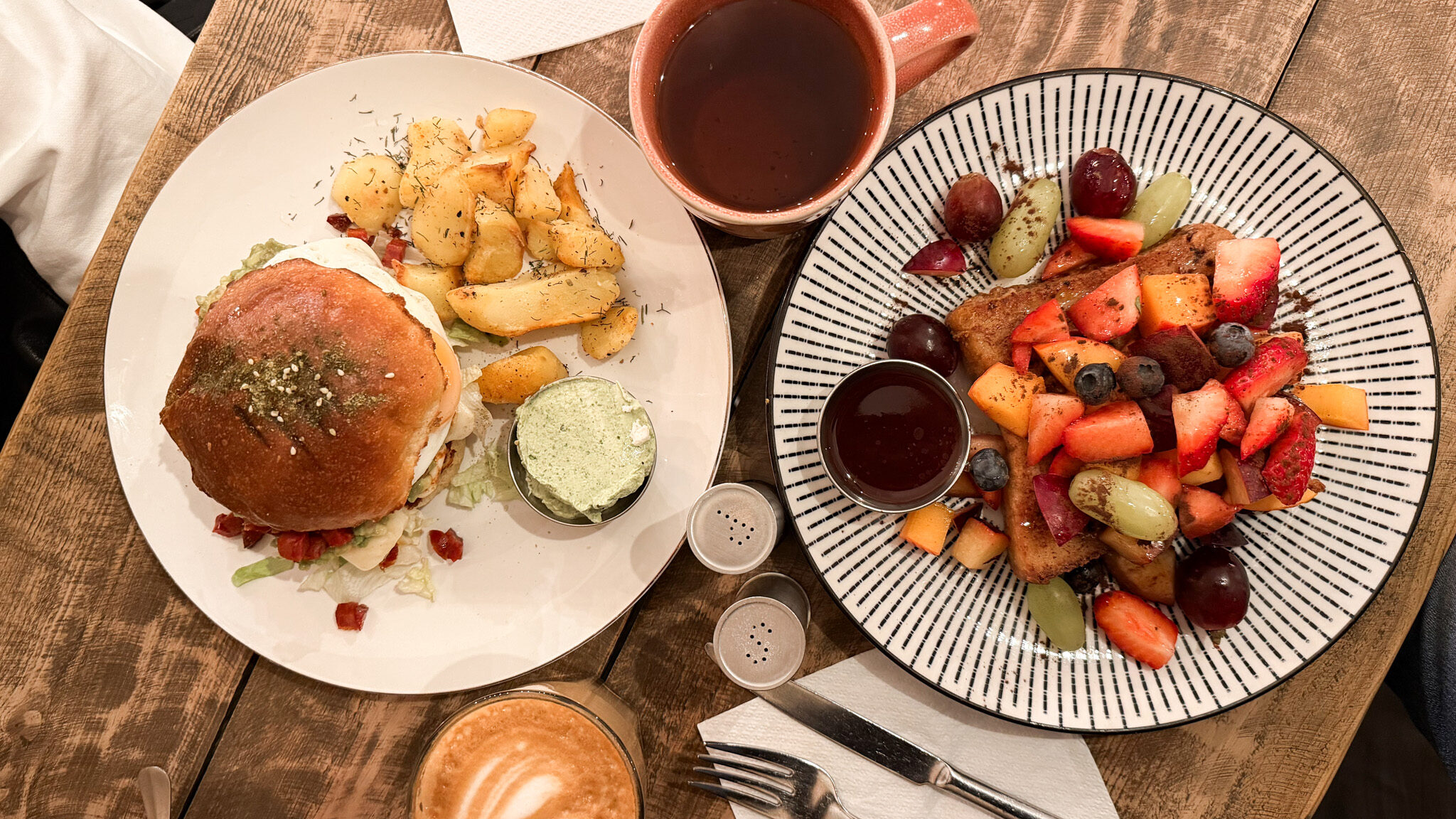 Breakfast burger and French toast with fruit.