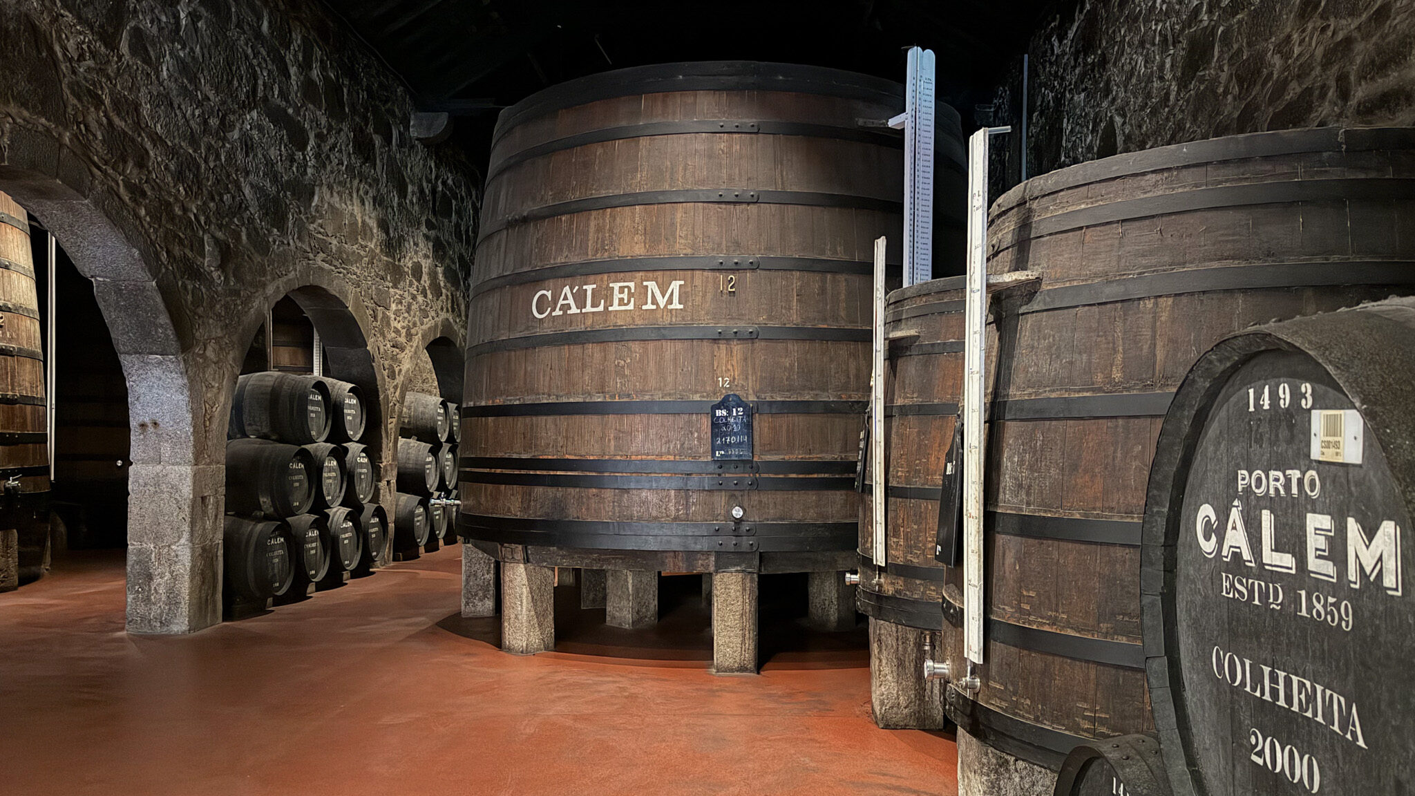 Large wine barrels inside cellar in Porto.