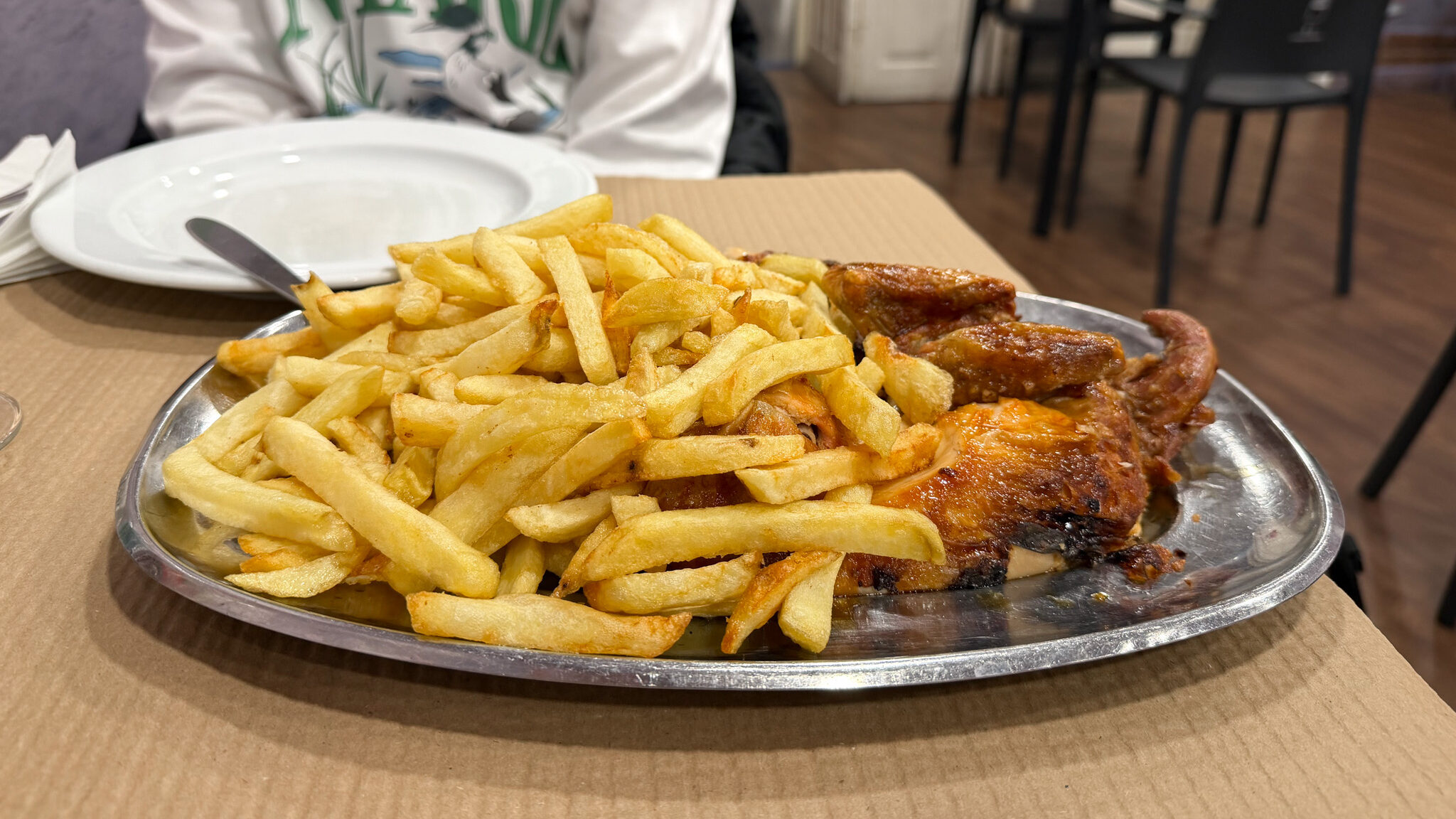 Frangos Porto | Krista the Explorer Metal plate with fries and rotisserie chicken.