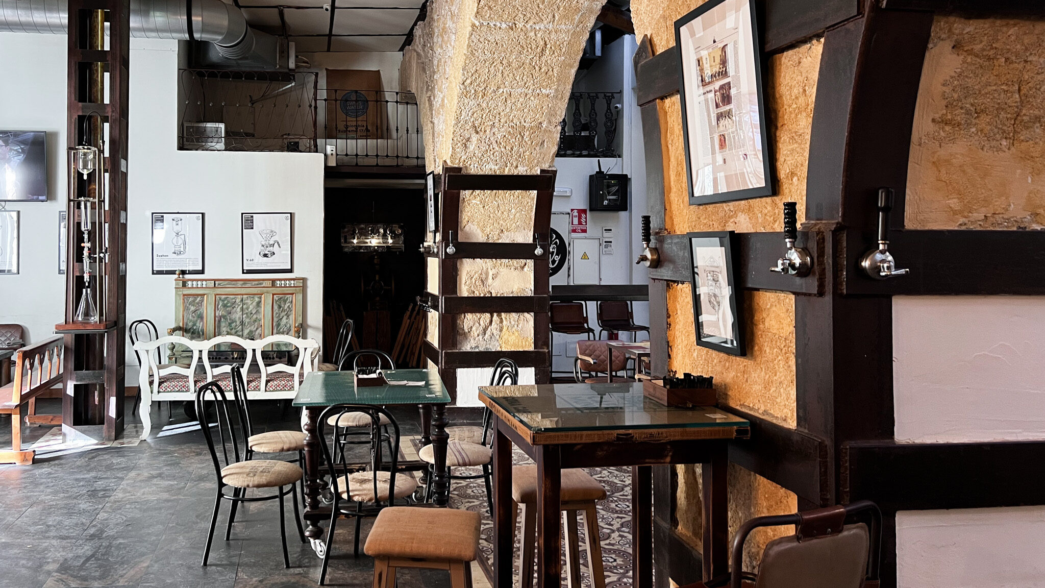 CafeLab Cartagena | Krista the Explorer Interior of cafe with historic walls.