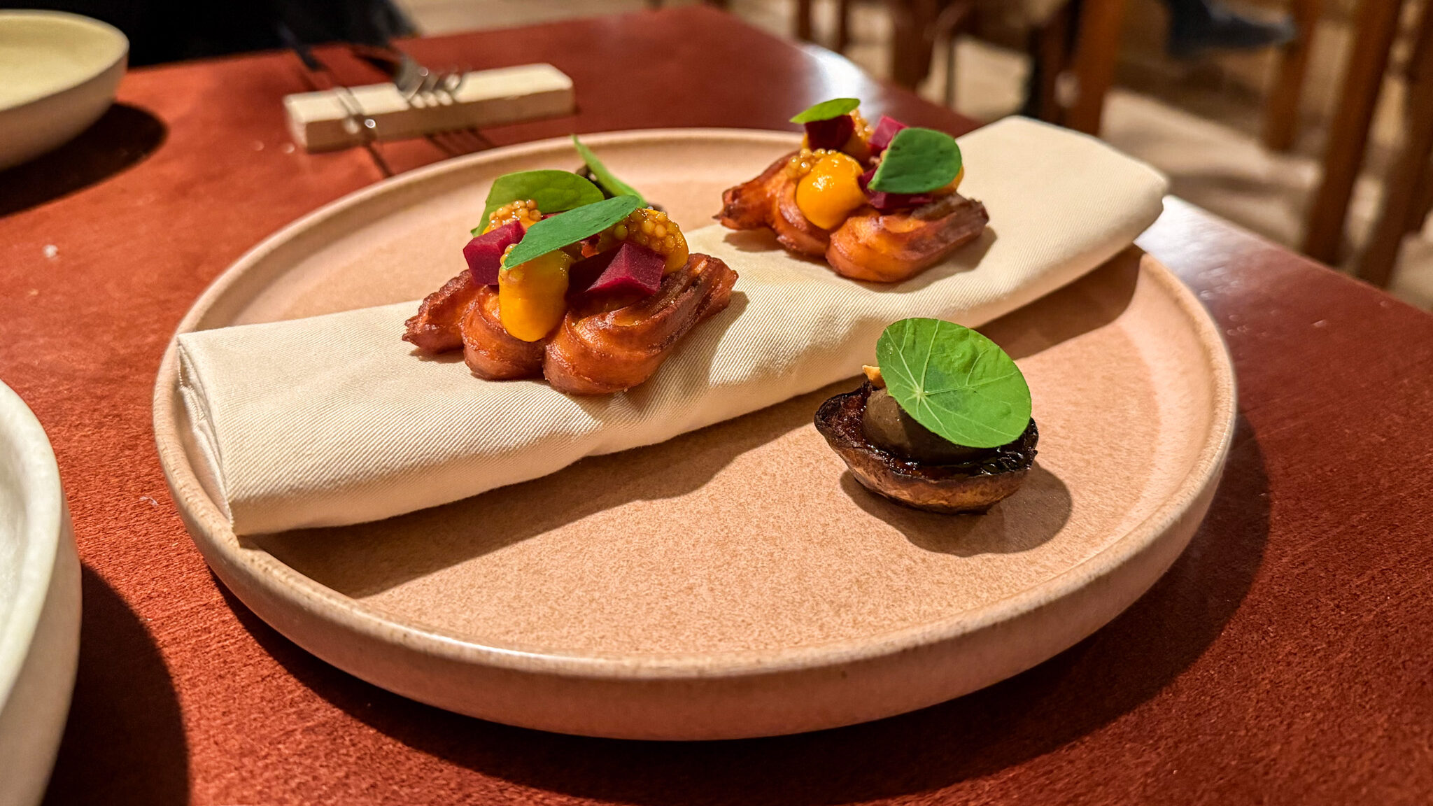 Two small starters served in fine dining restaurant.