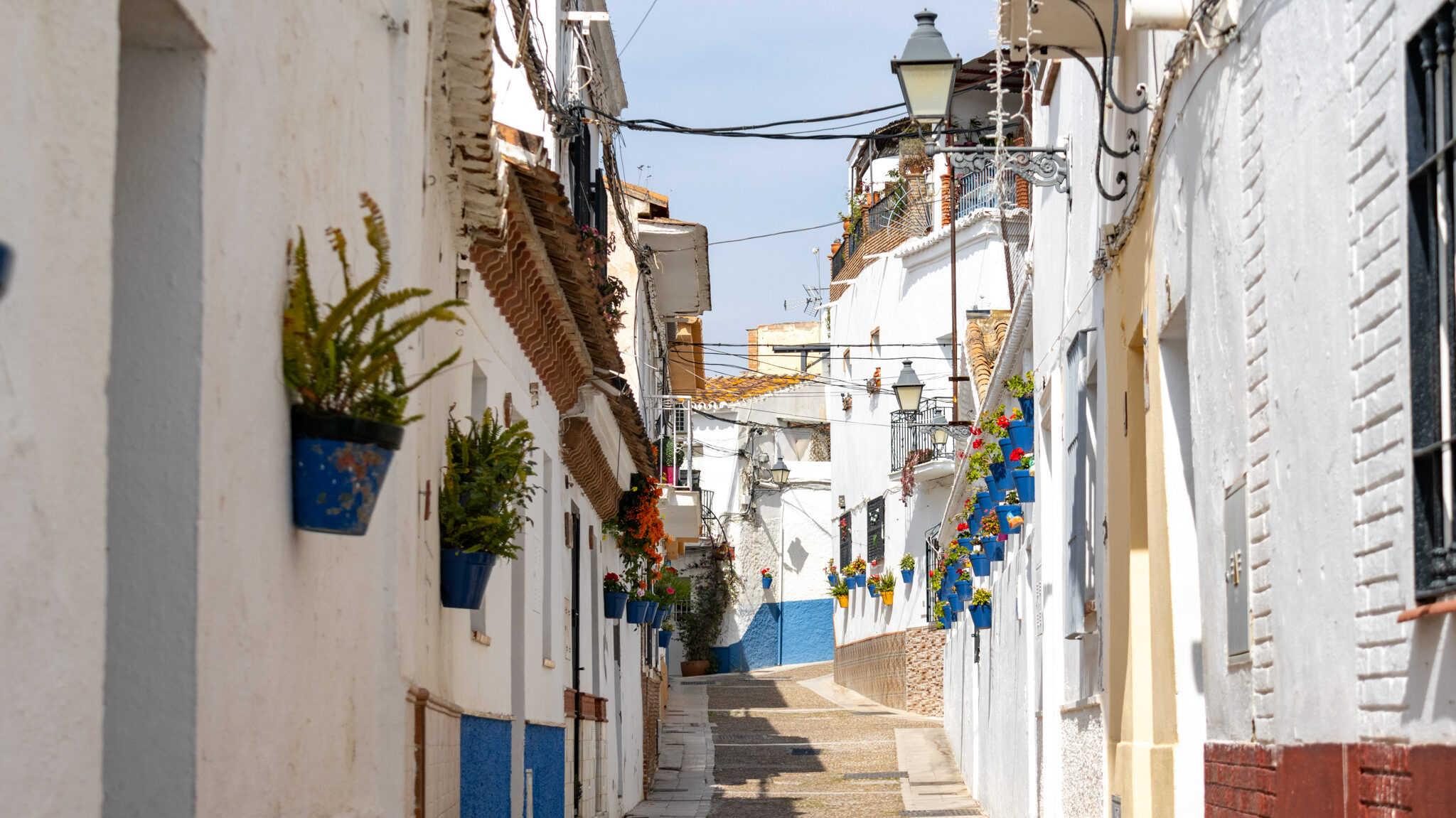 Old Town Velez Malaga | Krista the Explorer Whitewashed street in old town of Velez on sunny day.