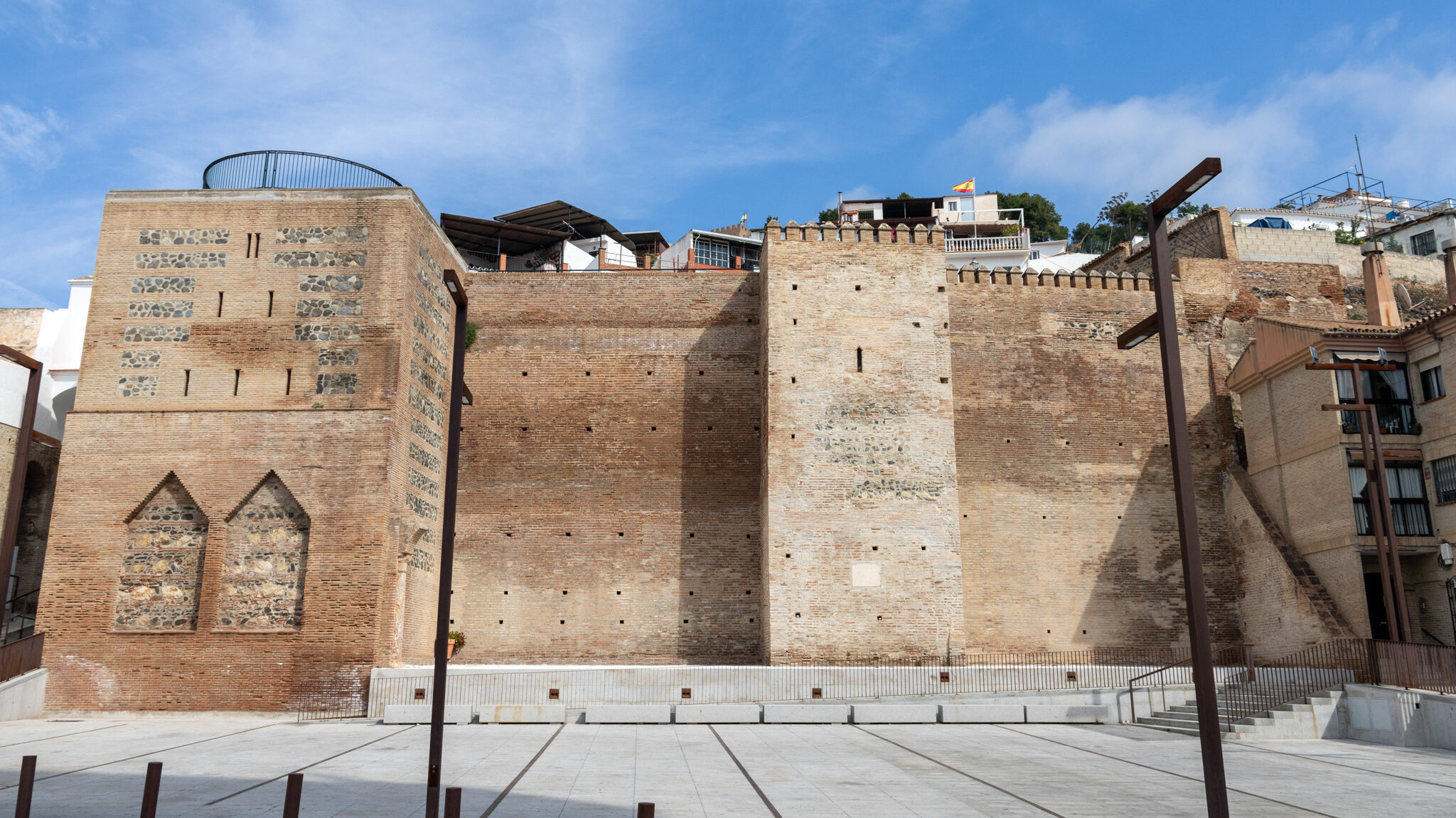 Plaza Velez Malaga | Krista the Explorer Large medieval city wall in modern plaza.