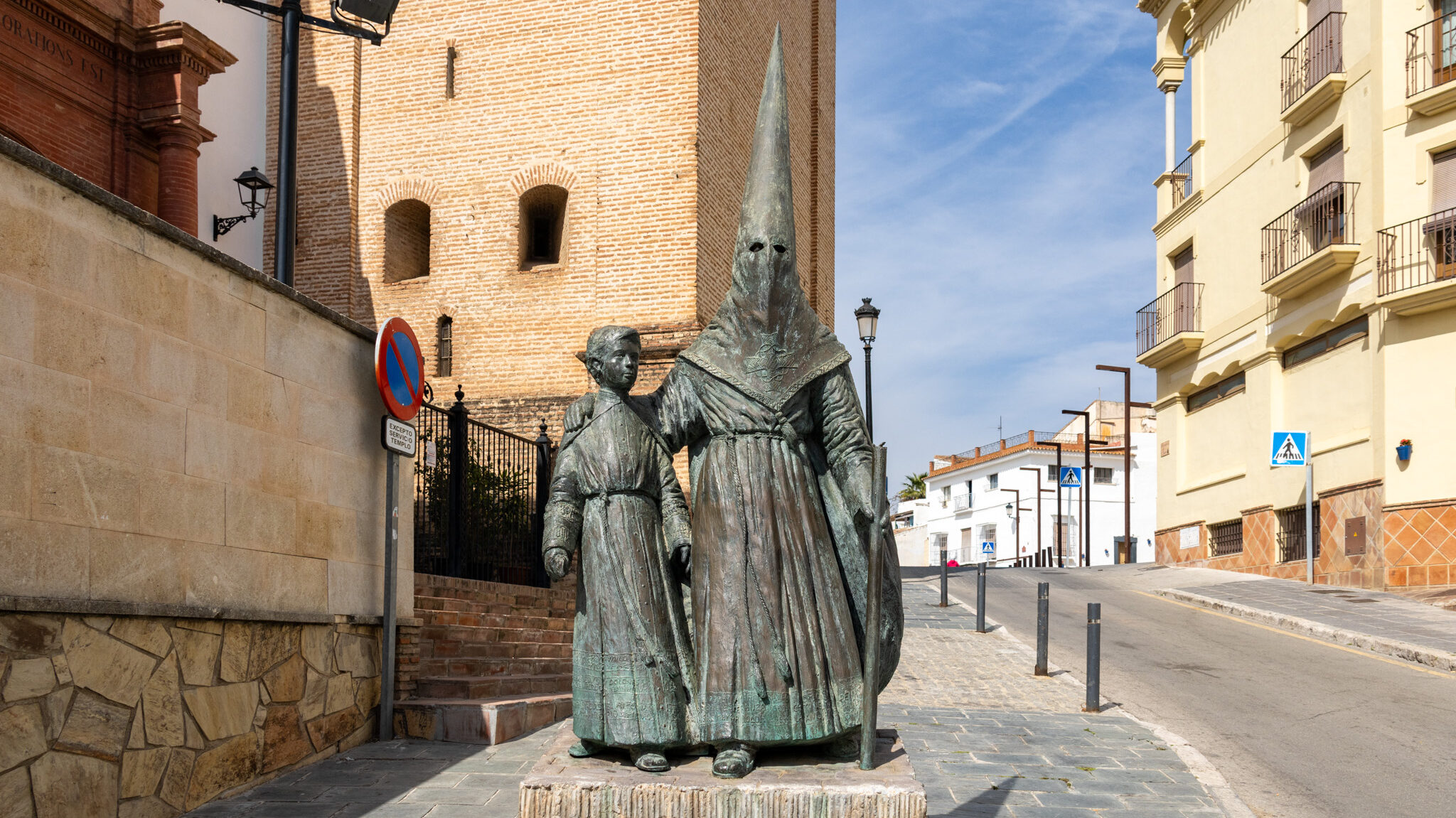 Nazareno Velez Malaga | Krista the Explorer Statue of Nazareno with small child outside church.