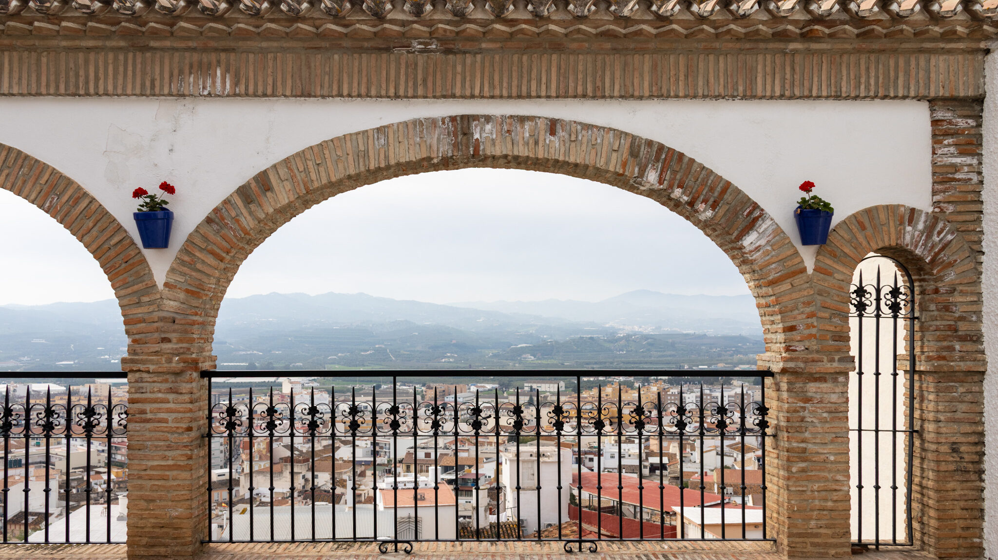 Mirador de Benamocarra Velez Malaga | Krista the Explorer Viewpoint in white village with brick arches.