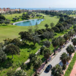 View of black car on road near seafront.
