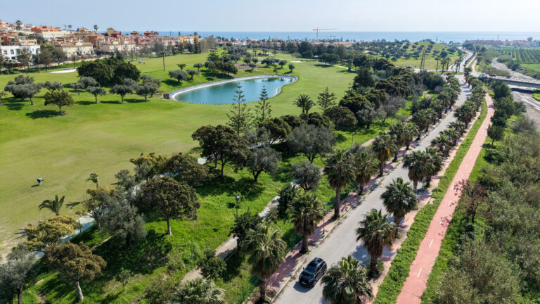 View of black car on road near seafront.