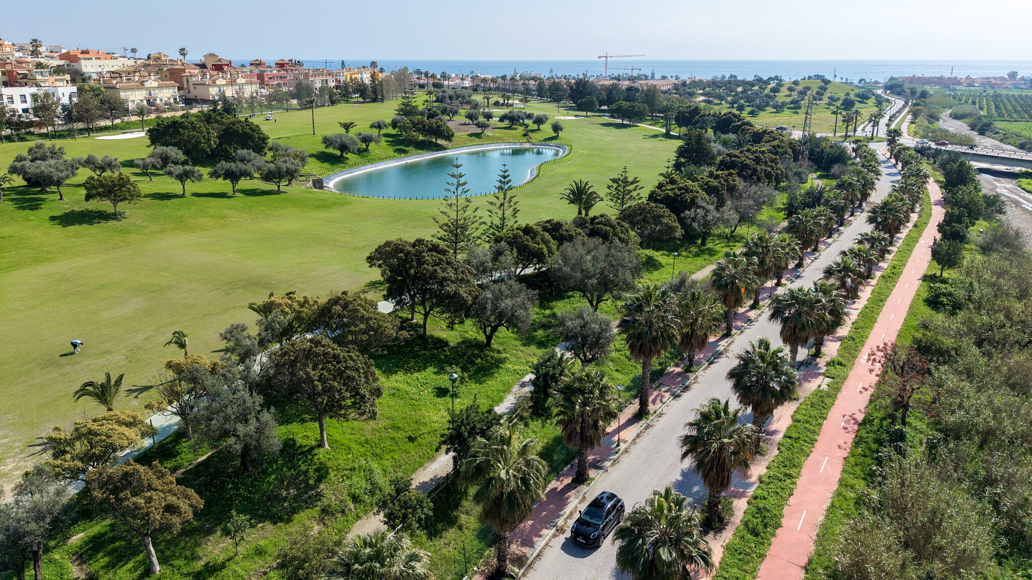 Marbella Car | Krista the Explorer View of black car on road near seafront.