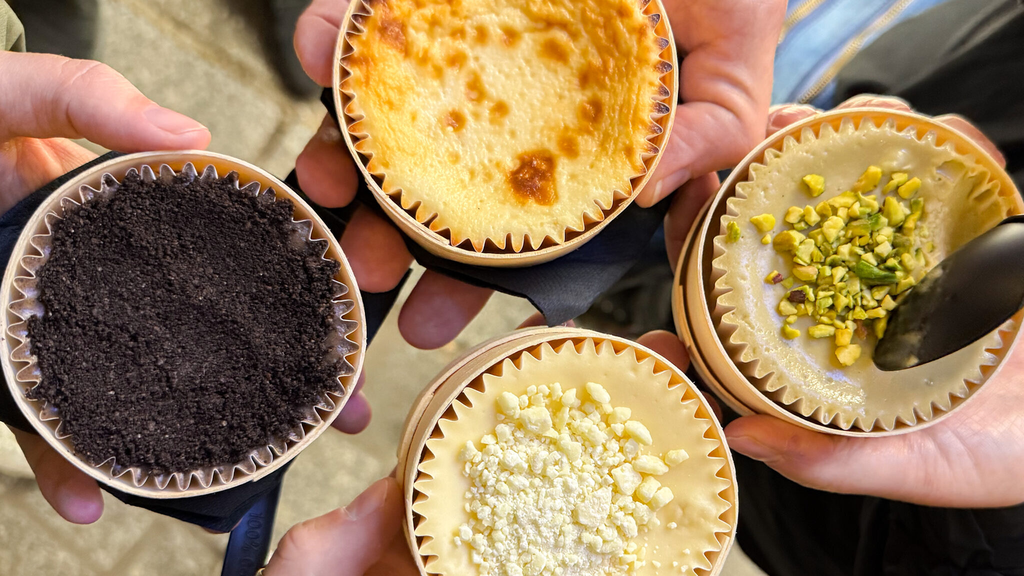 Four flavours of cheesecakes served in individual portions. 
