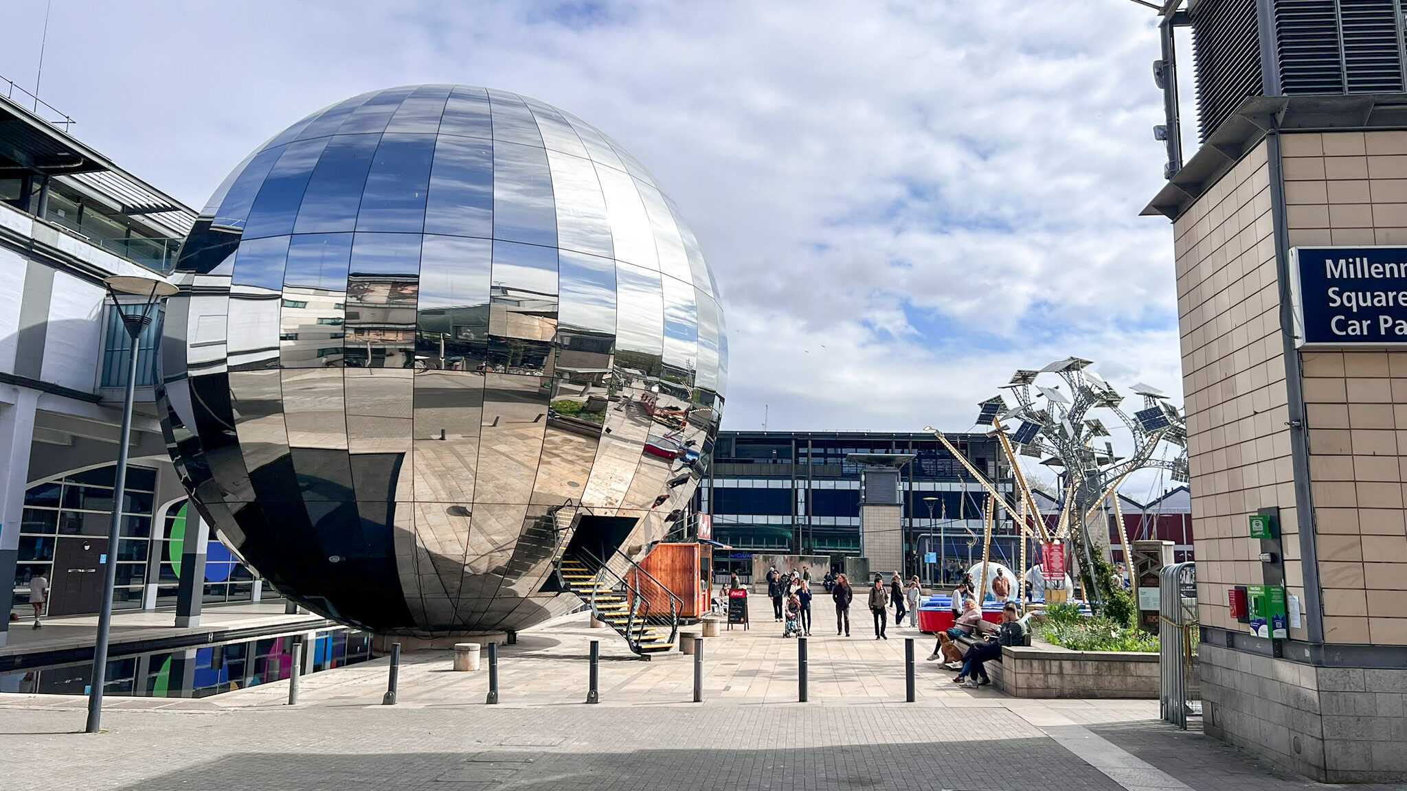 Large mirror ball in public square.