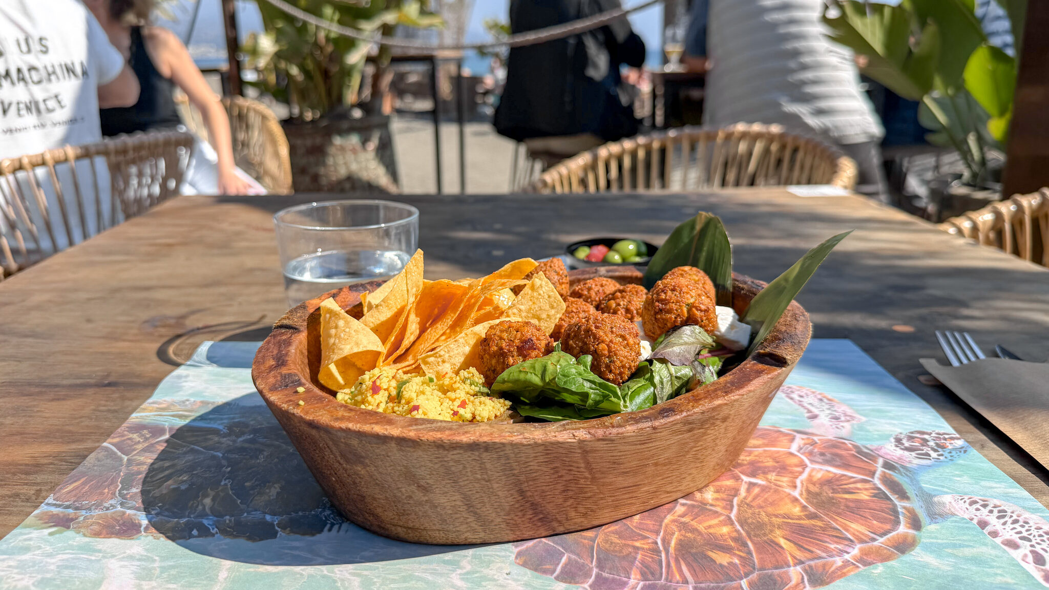 Wooden bowl filled with falafel salad in Torre del Mar.