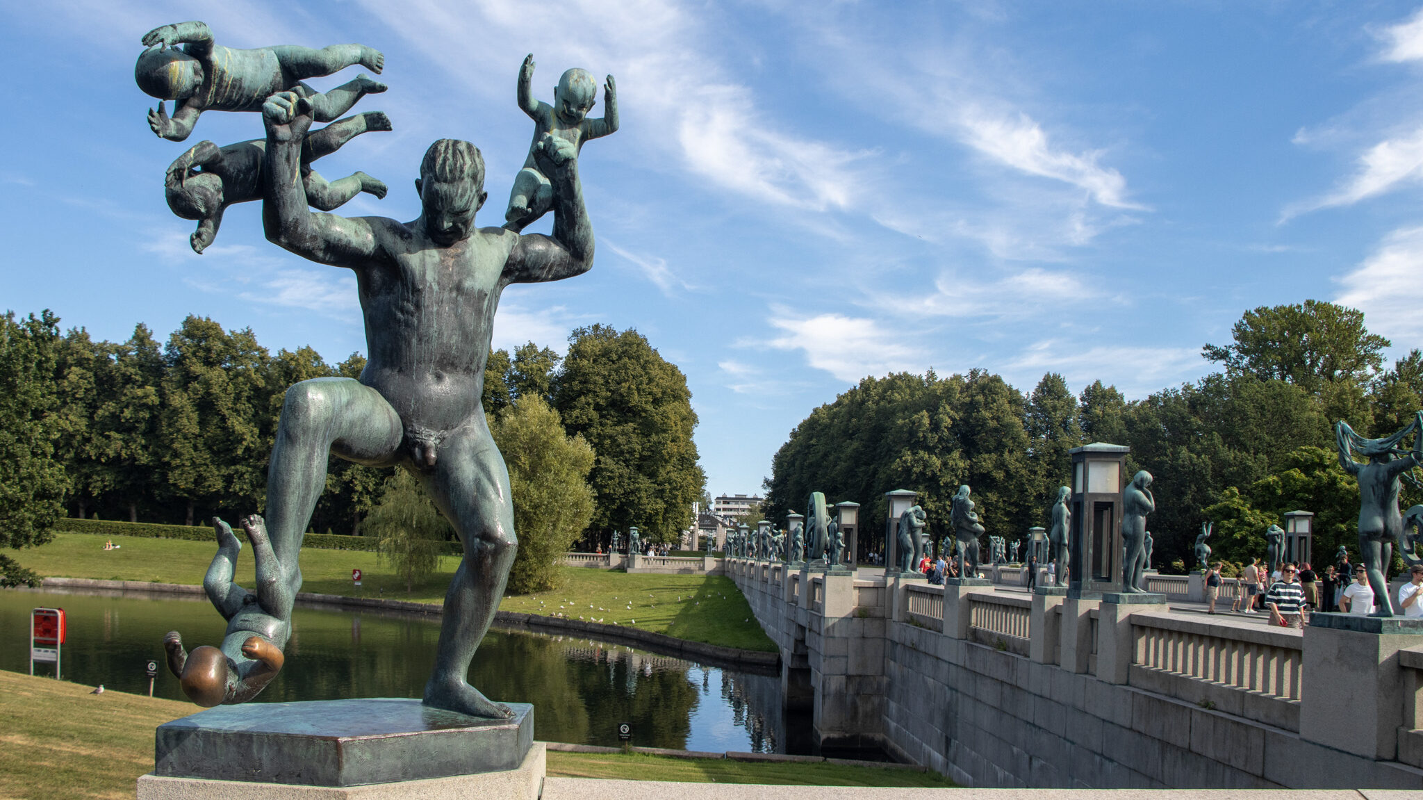 Vigeland Oslo | Krista the Explorer Iron sculpture set along river in park.