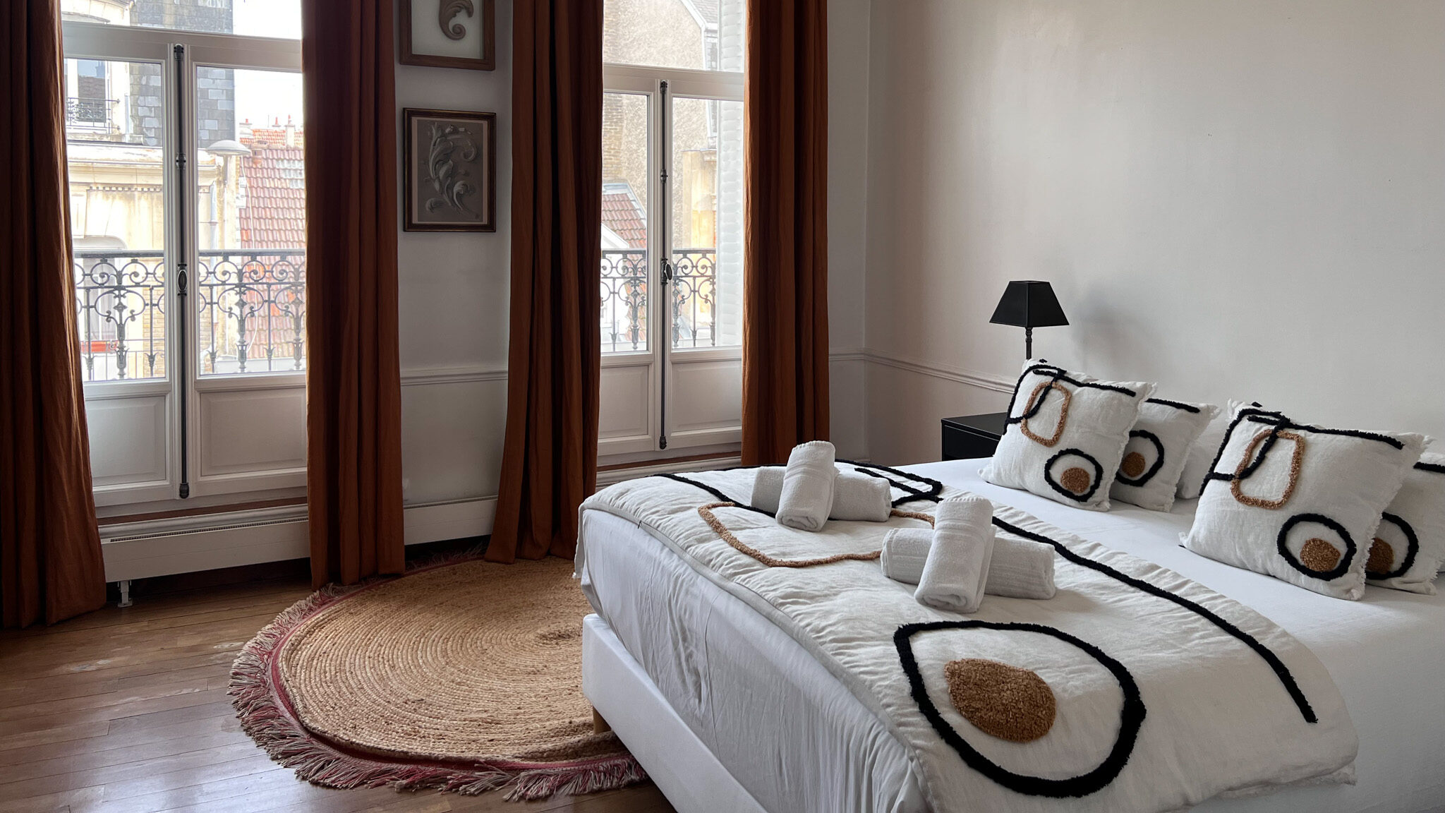 Large bed inside room in Reims hotel.