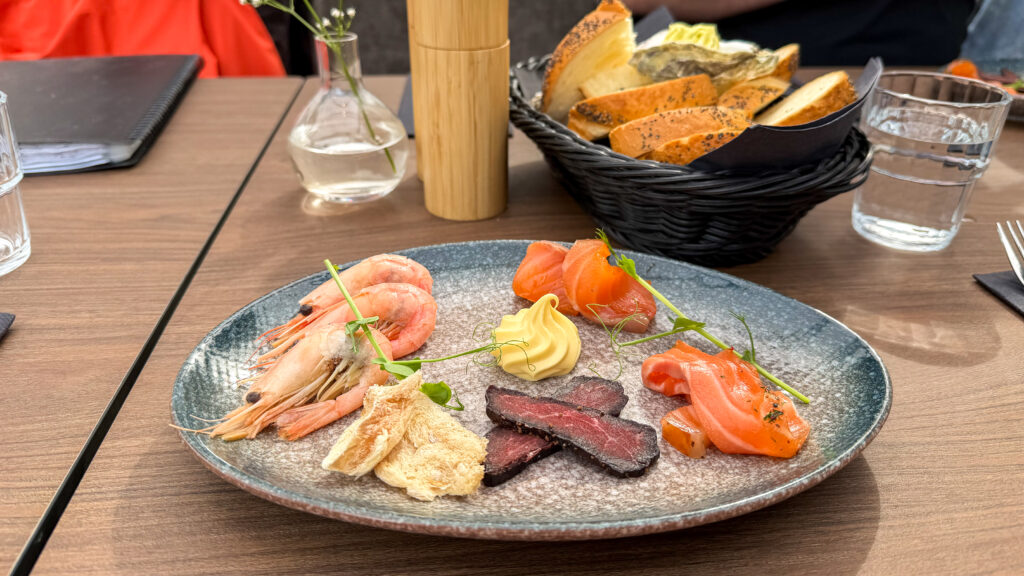 Plate at seafood restaurant with various fish tasters.