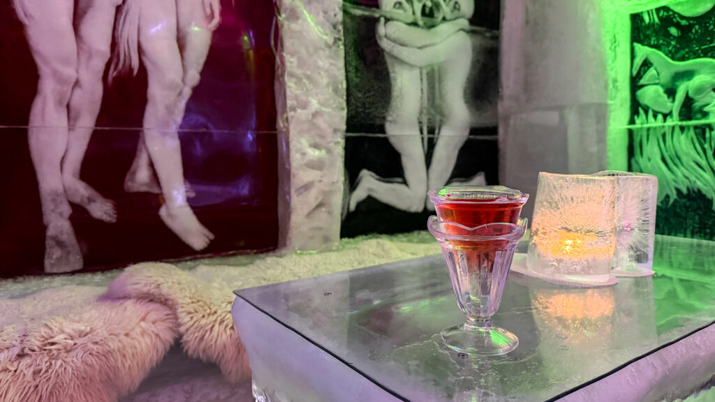 Cocktail served in ice glass inside an ice bar.