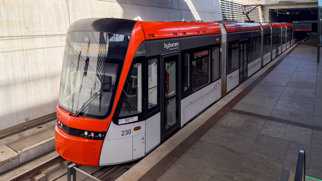 Light Rail tram parked at station next to airport.