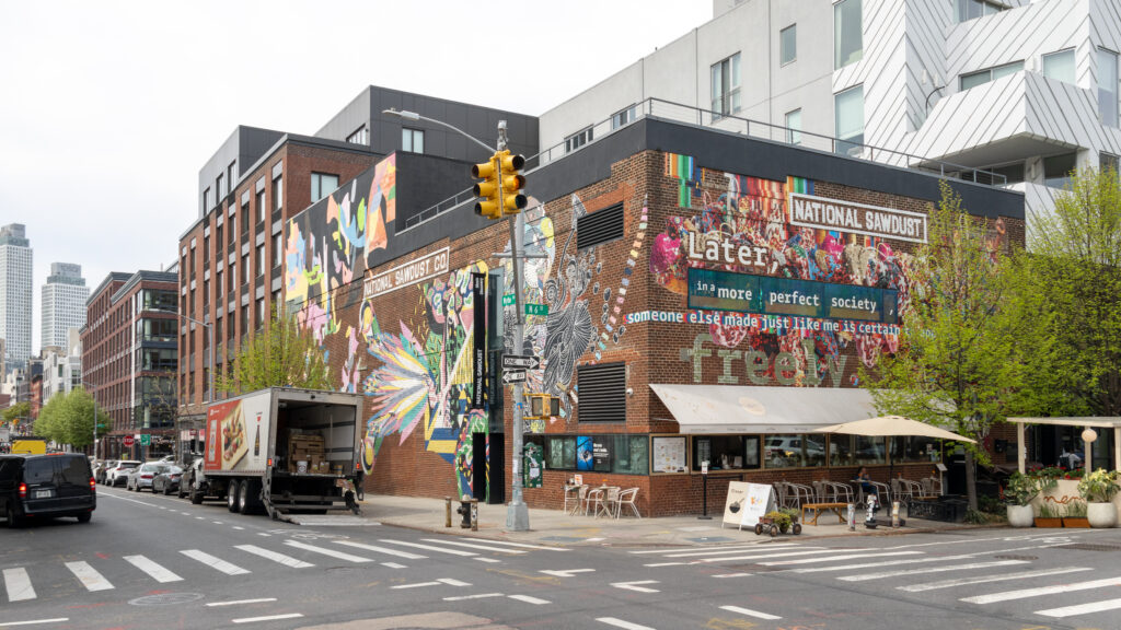 Williamsburg Brooklyn | Krista the Explorer Brick building with a vibrant mural on the corner.