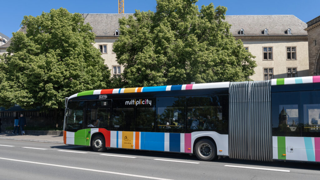 Bus Luxembourg | Krista the Explorer Bus in Luxembourg painted in colourful stripes.