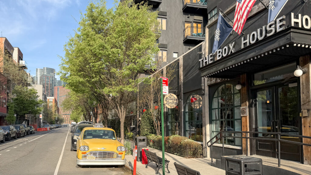 The Box House Hotel Brooklyn | Krista the Explorer Yellow taxi parked on a city street in front of a dark building.