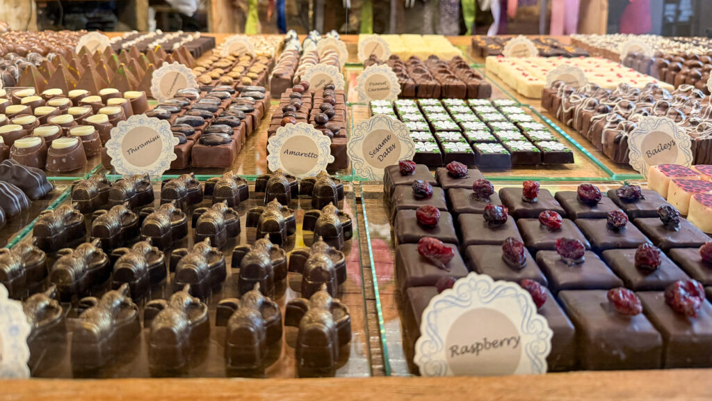 Chocolate House Luxembourg | Krista the Explorer Assorted chocolate pralines and truffles arranged in a display case.