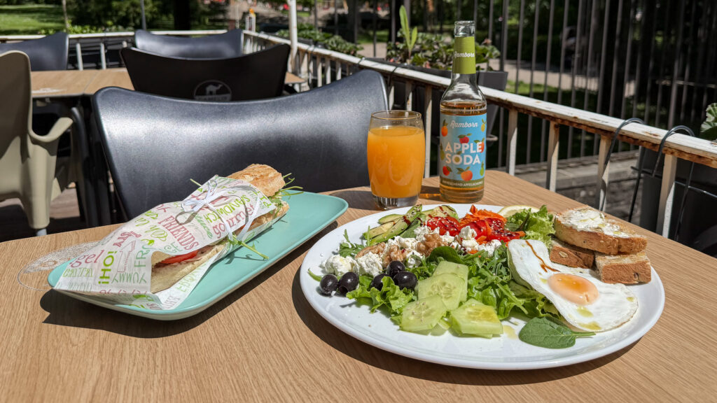 Sara's Brunch Luxembourg | Krista the Explorer Baguette and salad served on table on outdoor patio.