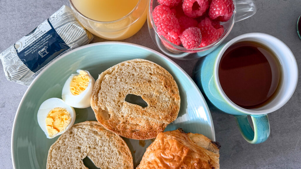 Barnet House Dunfermline | Krista the Explorer Breakfast dish with fresh fruits and drinks on the side.