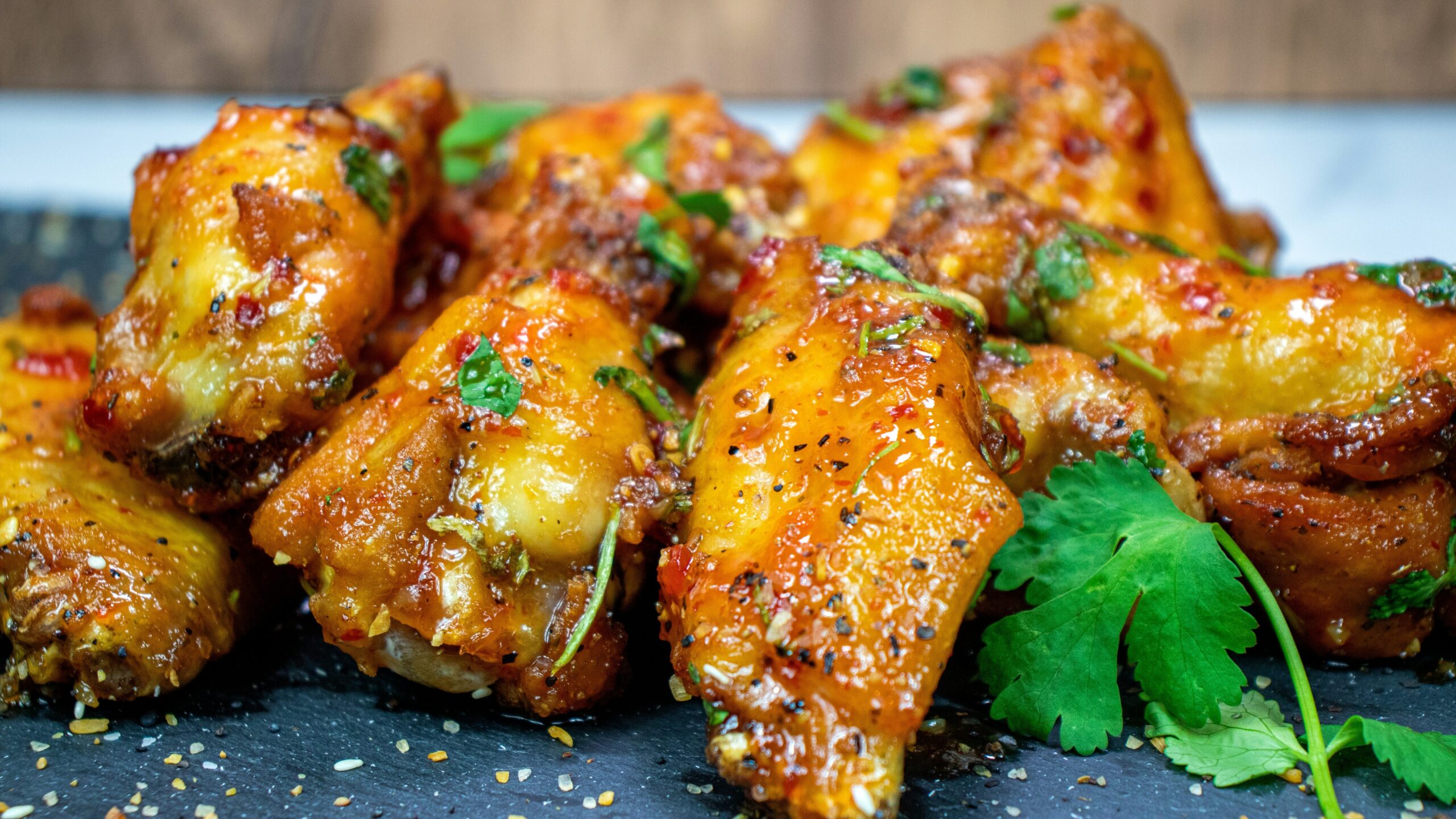 Sticky glazed chicken wings coated in a spicy herb glaze.