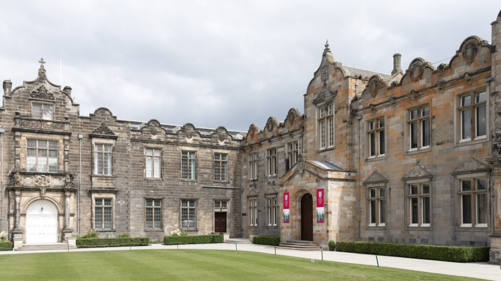 Historic stone buildings part of university campus.