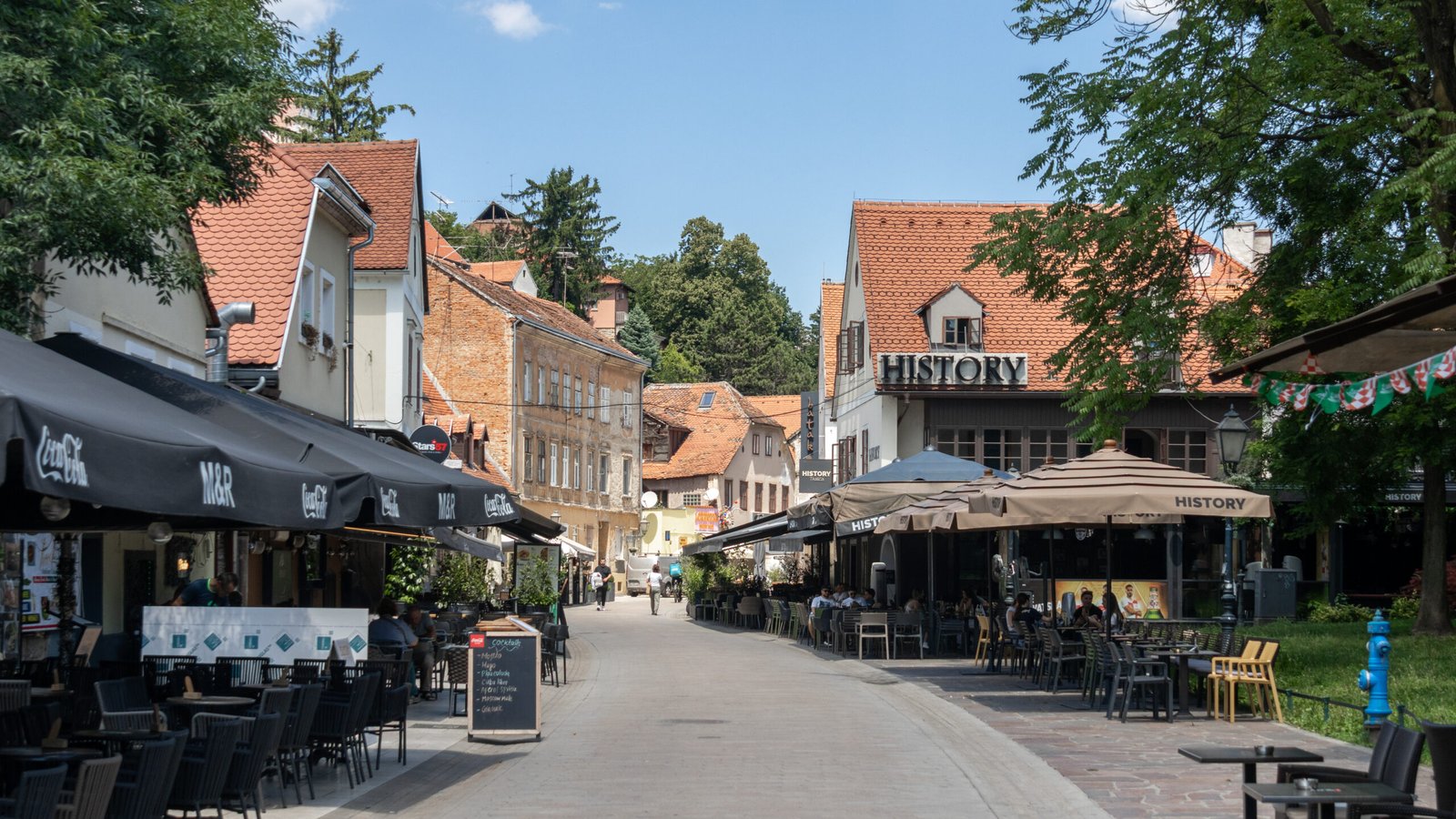 Historic street in Zagreb Old Town lined with restaurants.