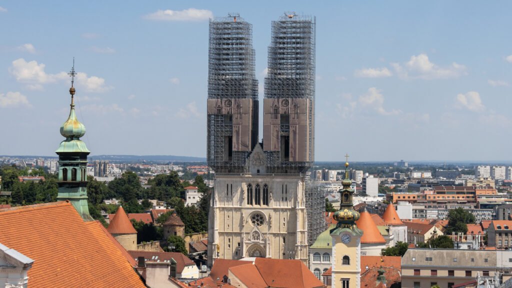 Cathedral of Zagreb | Krista the Explorer Cathedral of Zagreb viewed from above with towers covered in scaffolding.