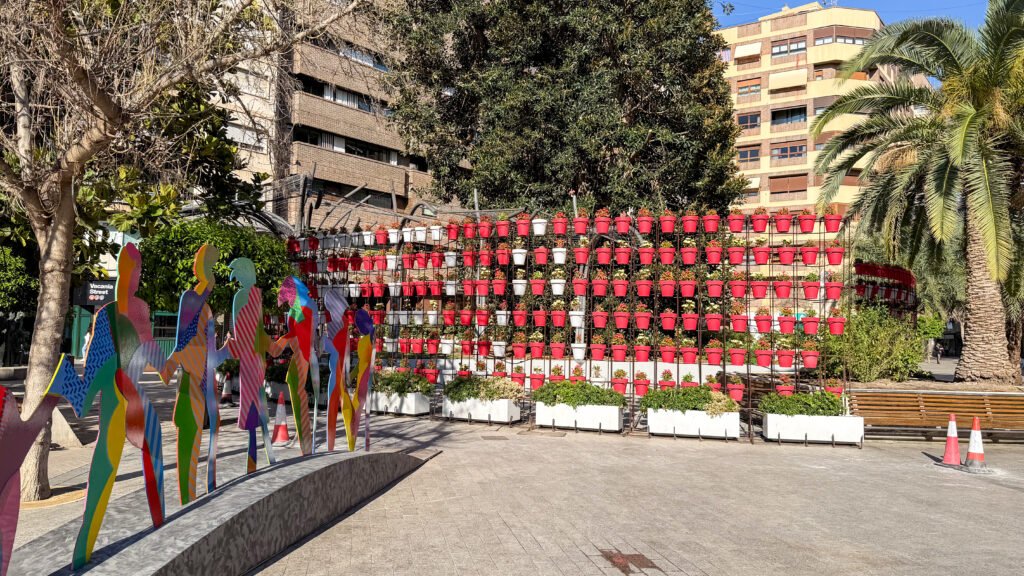 Plaza de Santo Domingo Murcia | Krista the Explorer Public art installation with multicoloured abstract human silhouettes in a plaza.