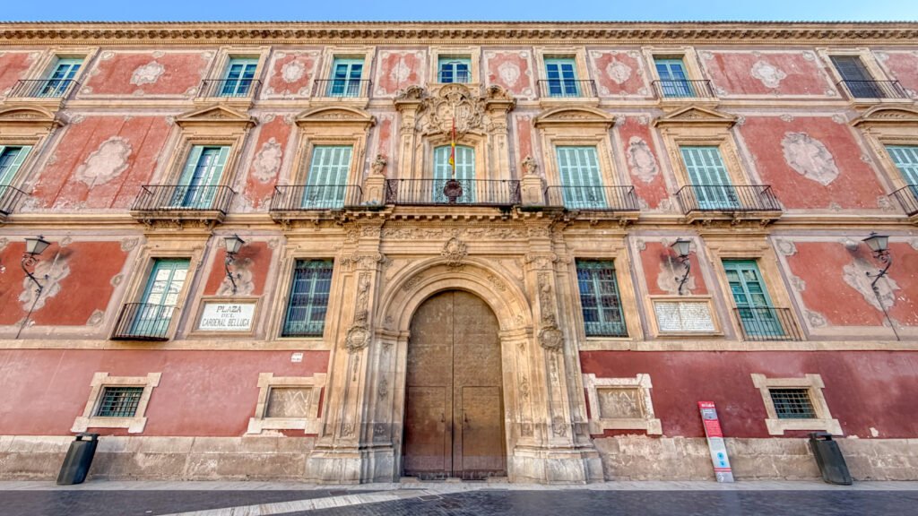 Plaza del Cardenal Belluga Murcia | Krista the Explorer Historic pink building one of the top things to do in Murcia.