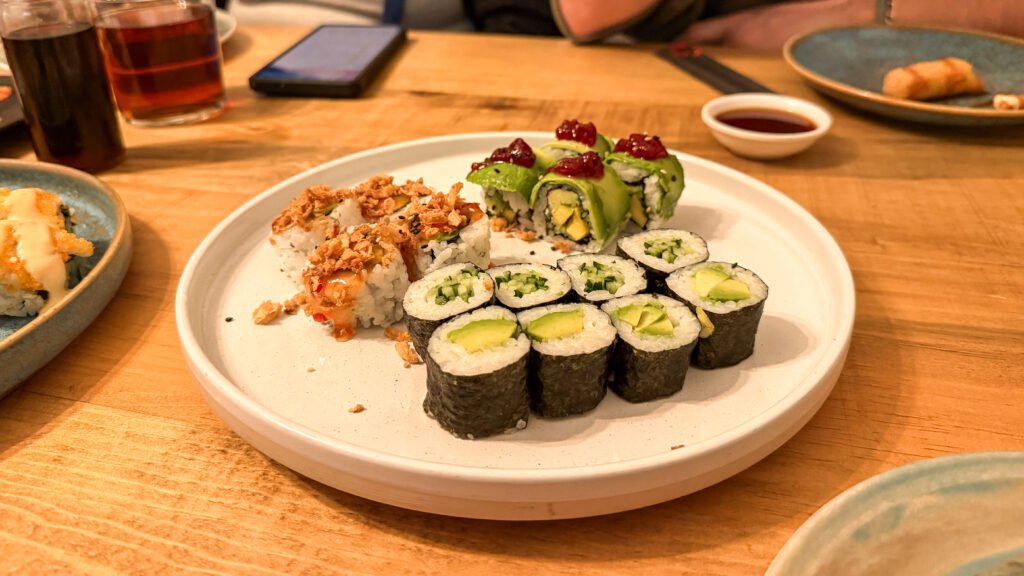 Miso Murcia | Krista the Explorer Plate of assorted sushi rolls in Asian restaurant.