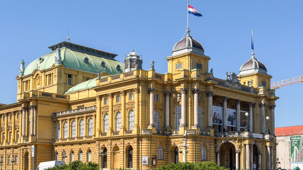 The Croatian National Theatre building painted yellow.