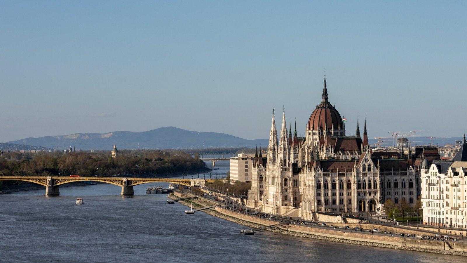 Budapest | Krista the Explorer | Krista the Explorer Sunset view of Danube River and buildings in Budapest.