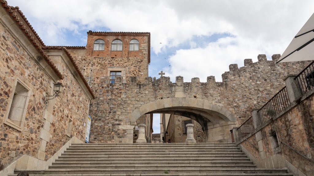 Arco de la Estrella Caceres | Krista the Explorer Stone arch at the top of steps one of the best things to do in Cáceres.