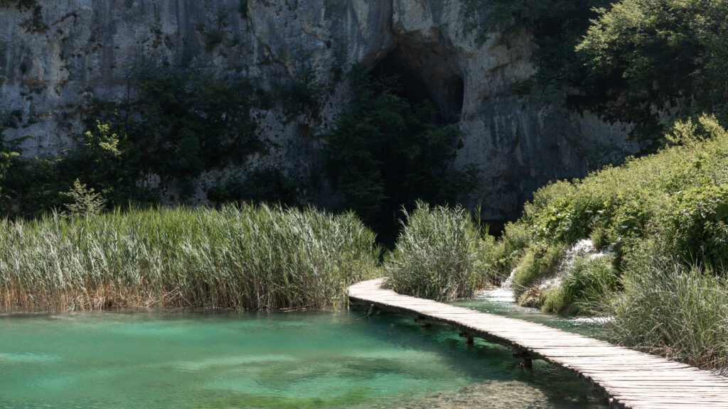 Plitvice Lakes | Krista the Explorer Wooden boardwalk crossing water during a trip to Plitvice Lakes from Zagreb.