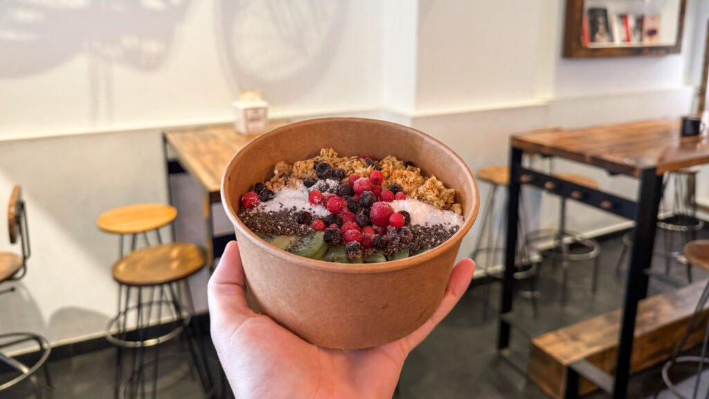 Zeri's Specialty Coffee Caceres | Krista the Explorer Acai bowl full of frozen fruits and granola.