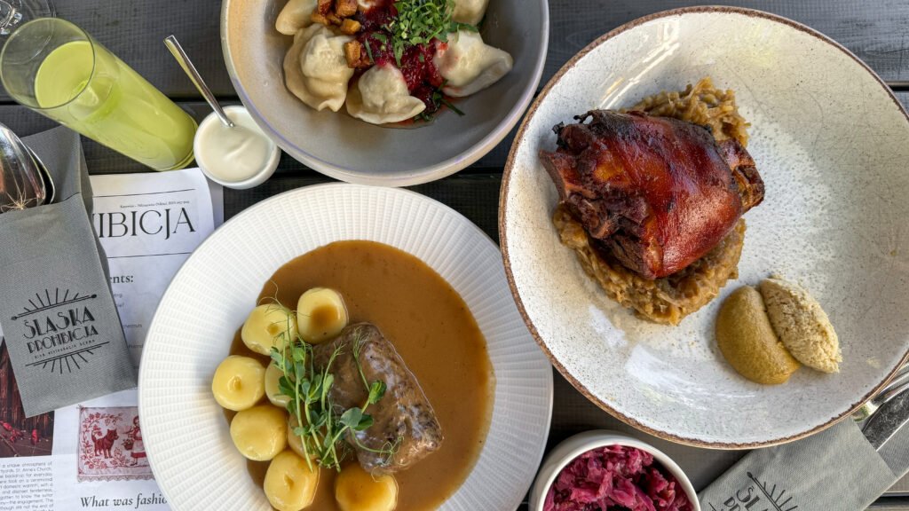 Pierogi, pork shank, and Silesian dumplings with gravy.