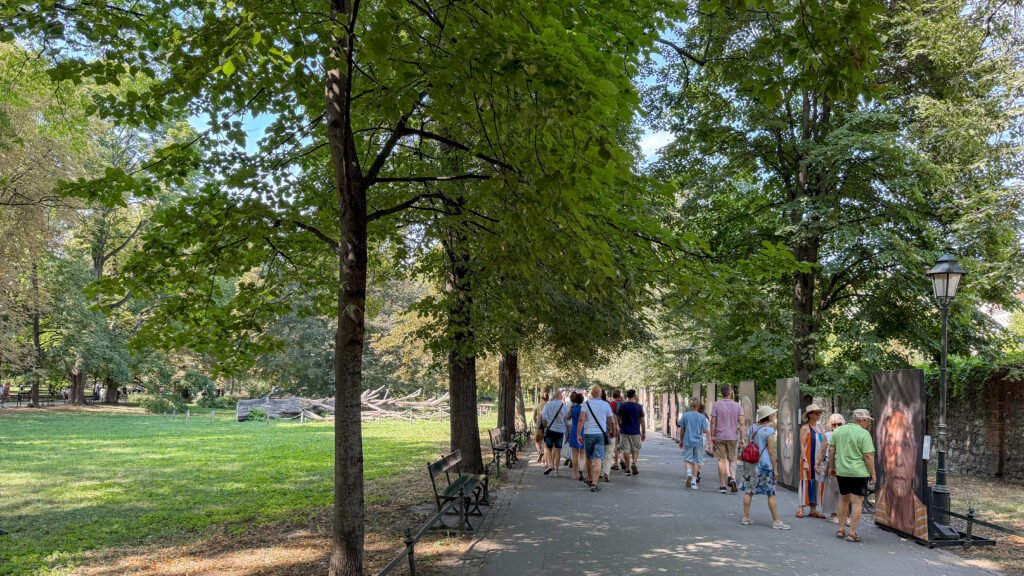 Planty Park Krakow | Krista the Explorer Green park space with people walking along path.