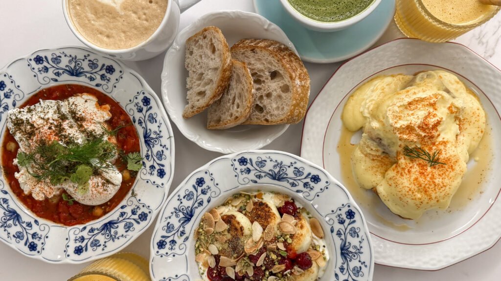 Fable Cafe Krakow | Krista the Explorer Top-down view of a brunch spread with blue-patterned bowls during a weekend in Krakow.